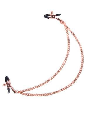 The Pink Entice Tiered Intimate clamps are displayed against a blank background. The rose gold clamps have black rubber tips and a screw to adjust the tension and are connected by two chains.