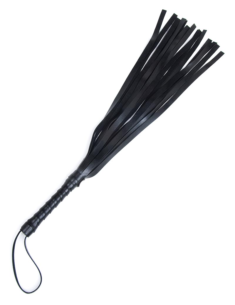 The black vinyl S&M Mini Flogger from Sportsheets is displayed against a blank background. The flogger has thin black falls, a wrapped handle, and a small loop at the base of the handle.