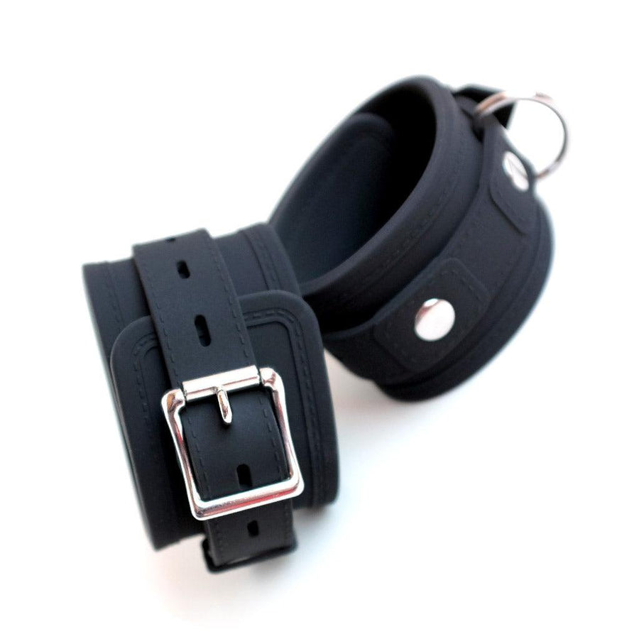The Silicone Bondage Locking Wrist Cuffs are displayed against a blank background, showing the D-Ring and the lockable buckle