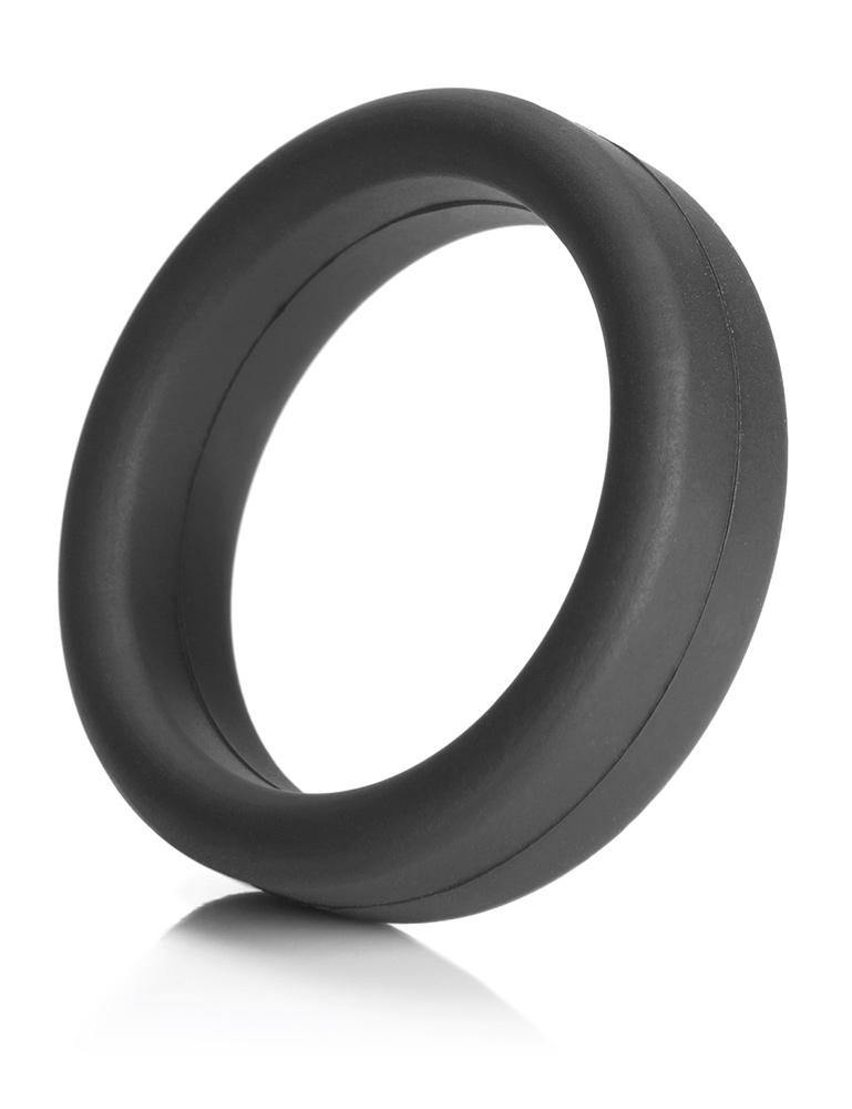  A Tantus Super Soft C-Ring in black is displayed against a blank background. It is a ring made of a thick band of matte black silicone.