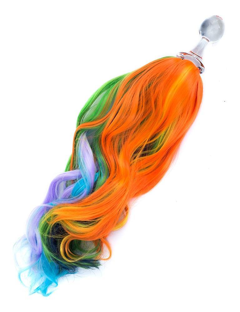 The Rainbow Detachable Ponytail Glass Butt Plug is shown against a blank background. The plug is made of clear glass and has a long tail of multi-colored hair attached to the base.