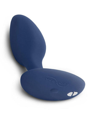 The We-Vibe Ditto Vibrating Butt Plug is shown from the bottom against a blank background. The We-Vibe logo is on the base of the toy as well as two magnetic charging ports. 