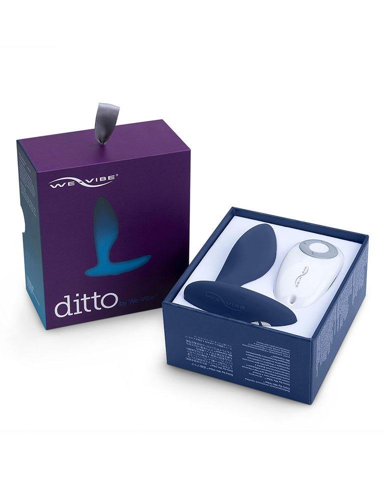 The We-Vibe Ditto Vibrating Butt Plug is displayed in its box against a blank background. 
