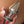 Load image into Gallery viewer, A close-up of somebody’s hand with a French manicure is shown holding the Electrastim Electro Butt Plug with wires plugged into the base.

