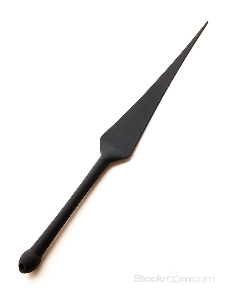 The Tantus Silicone Dragon Tail, made of matte black silicone, is displayed against a blank background. It has a flat, triangular top and a cylindrical handle with a bulbous end.