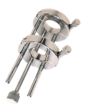 The Ze Extreme Double Stainless Steel Adjustable Ball Bruiser is shown against a blank background. It is made of 2 rings stacked on top of each other, supported by 2 posts. The size of the rings and the space between them are adjustable.