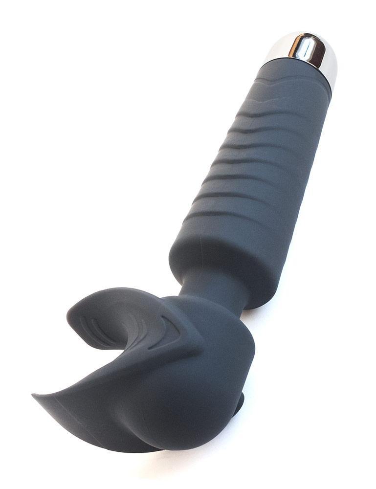 The Man Wand Silicone Vibrating Penis Masturbator is shown on its side against a blank background.