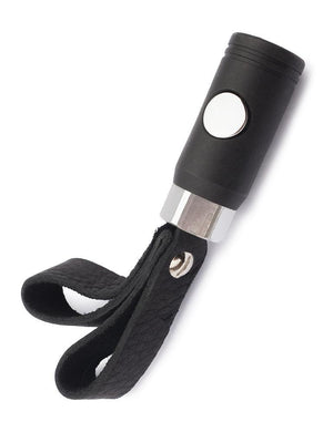 The black Finger Flogger Grip is displayed against a blank background. The grip is a short black handle with a silver button in the center and two black leather loops at the end.