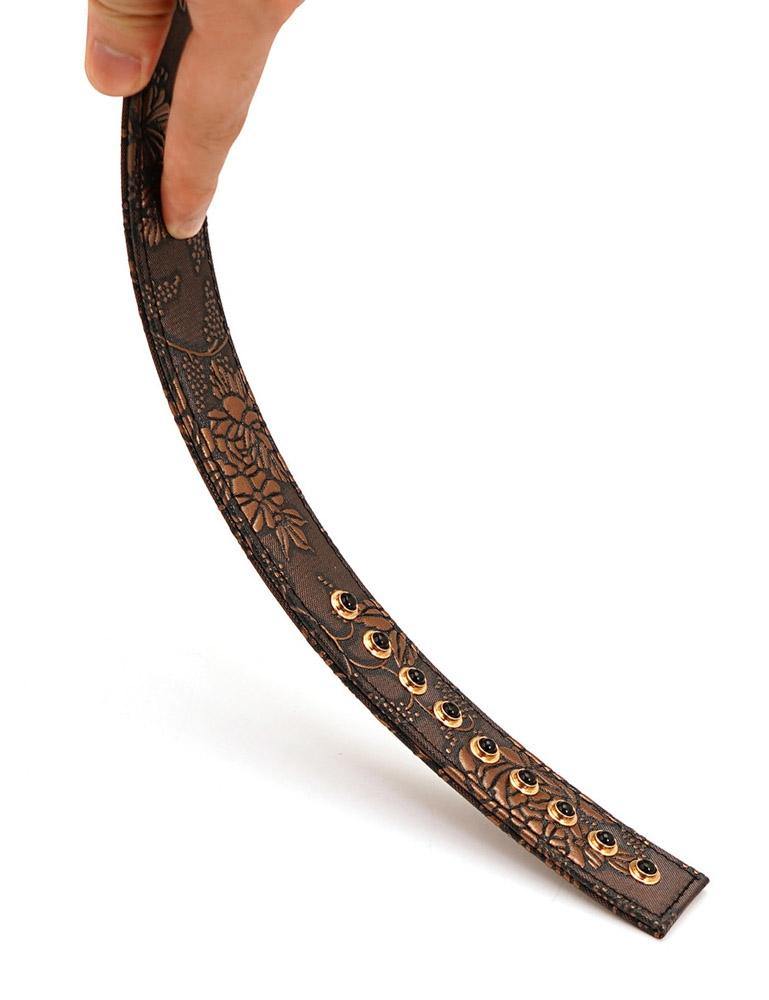 The Vegan Floral Ruler With Gems is shown being bent by somebody against a blank background, displaying its flexibility.
