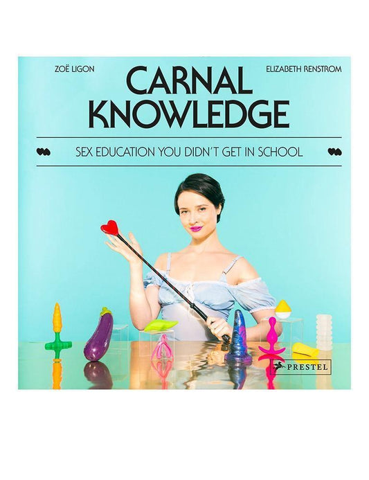 A photo of the cover of the book Carnal Knowledge by Zoë Ligon and Elizabeth Renstrom is displayed against a blank background. The cover is blue and depicts a woman sitting at a table with sex toys.