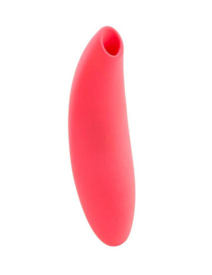 The We-Vibe Melt Pleasure Air Clitoral Vibrator in Coral is shown from the front against a blank background. From a forward angle, the toy is oval shaped.