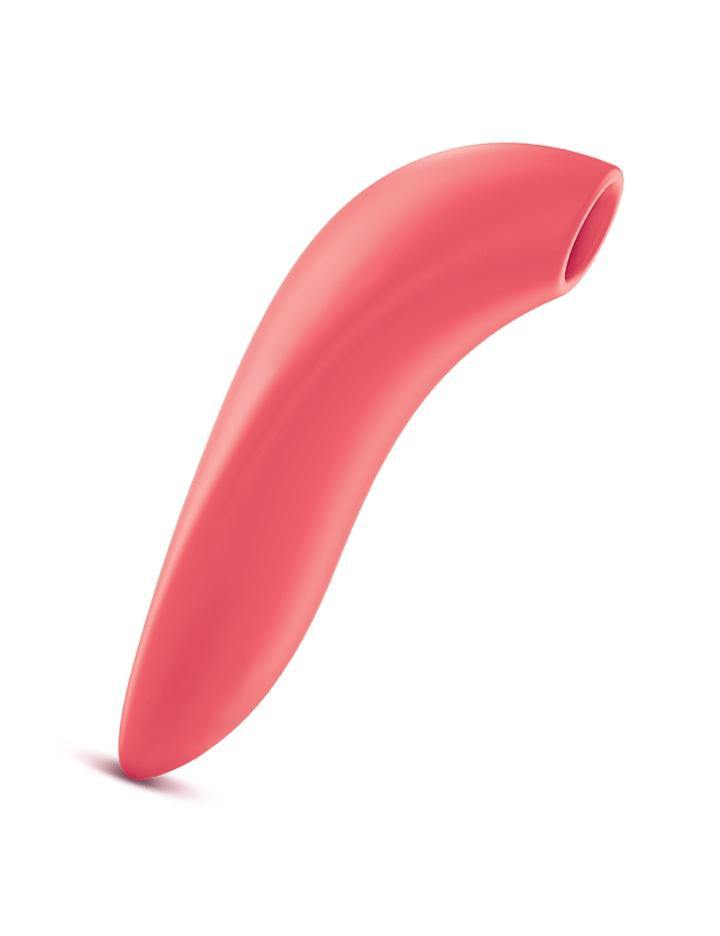 The We-Vibe Melt Pleasure Air Clitoral Vibrator in Coral is shown from the side against a blank background. The toy has a straight handle a sligtly curved top, where there is a hole.