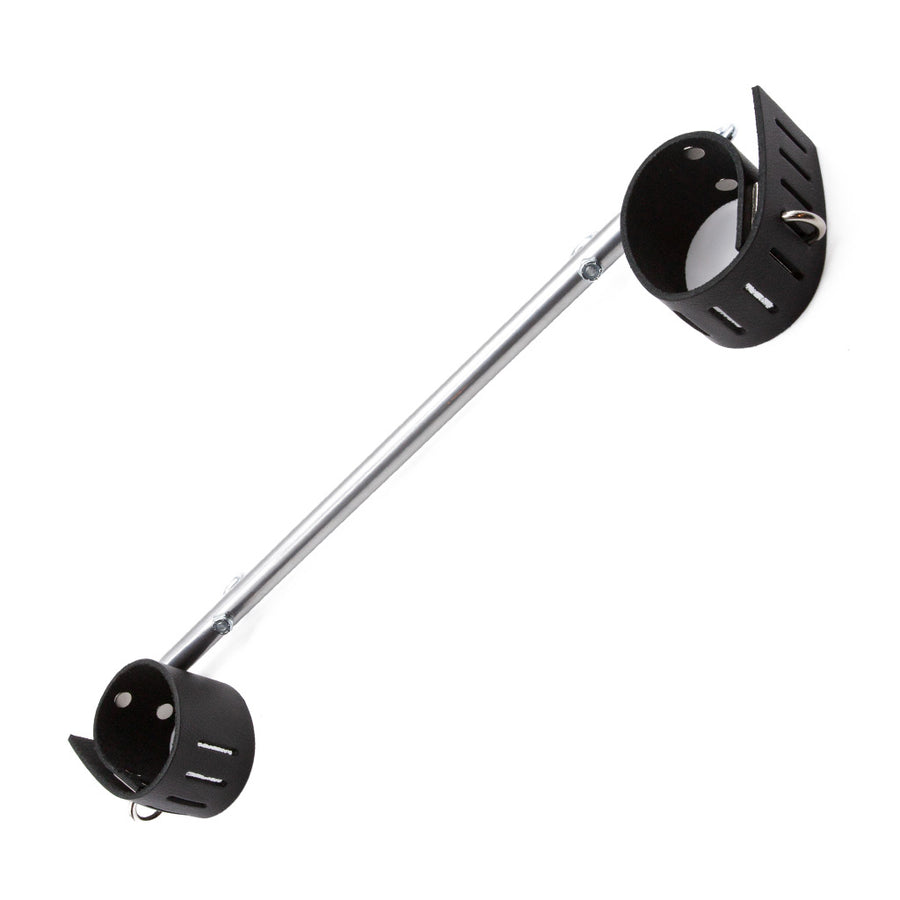The Chrome Wrist Spreader Bar with Leather Cuffs is shown against a blank background. It is made of a chrome rod with black leather wrist cuffs on each end. The cuffs are adjustable and have hasp closures.