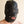 Load image into Gallery viewer, A person&#39;s head in the Premium Leather Hood with a Gag and Blindfold is shown against a beige background. The hood is made of black leather with silver hardware. The gag has been removed, exposing their mouth. The blindfold is hourglass-shaped.
