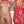 Load image into Gallery viewer, Two nude brunette women are shown from the neck down standing next to each other, one facing the camera and the other facing away. They both wear the Stockroom red leather Arm Binder with a zipper closure.
