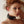 Load image into Gallery viewer, A close-up of a red-haired woman standing in front of a white wall is shown. She is wearing the Leather Buckling Collar with Scalloped Edges.
