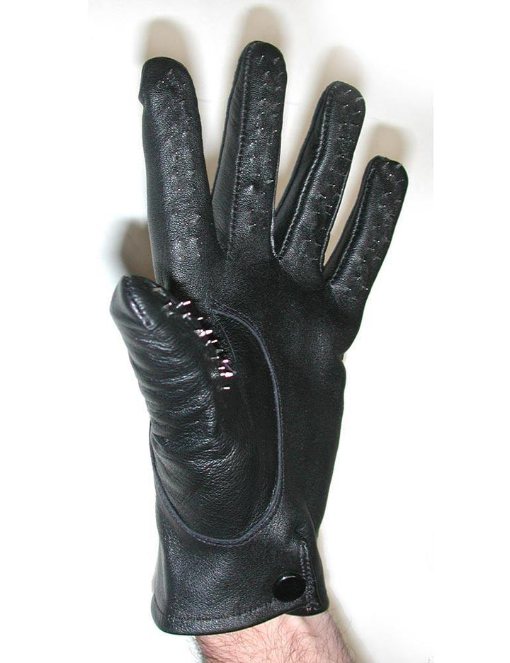 A man’s hand wearing a Vampire Glove is displayed against a blank background. The gloves are wrist-length and made of black leather with a black snap fastener on the wrist. The inner parts of the fingers are covered in small, silver spikes.