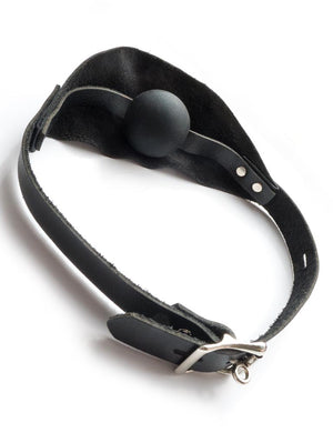 The Over The Mouth Gag With A Silicone Ball is shown from the back against a blank background. Behind the piece of leather is a black silicone ball gag. The strap is secured with a silver lockable buckle.