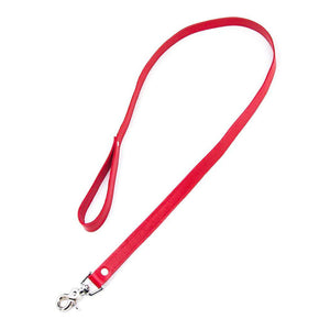 The red Premium Garment Leather Leash is shown against a blank background. It is a strip of red leather with a wrist loop on one end and a metal snap hook on the other.