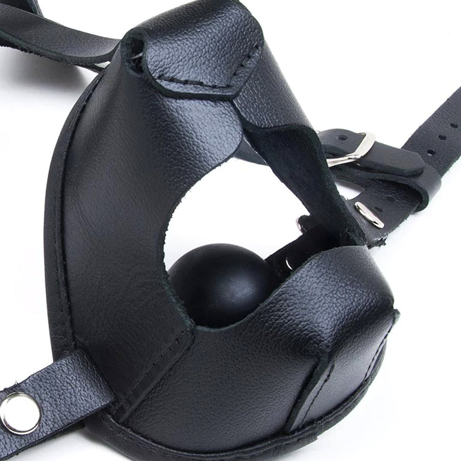 A closeup of the front of the snout of the K9 Muzzle With Removable Silicone Ball Gag is shown against a blank background, displaying the silicone gag.