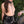 Load image into Gallery viewer,  A topless woman wearing a black latex pencil skirt, belt, and silicone collar stands in front of a plant outdoors. A hand in the corner of the image holds the handle of the silver metal Vondage Chain Leash that’s attached to her collar.
