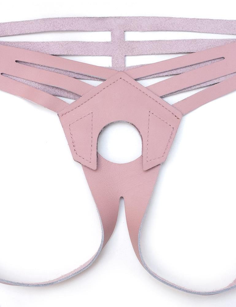 A close-up of the pink Vanity Strapon Dildo Harness is displayed against a blank background. 