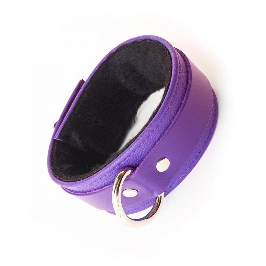 A single Purple Fleece Lined Garment Leather Ankle Cuff is displayed against the background. It is rotated so that the cuff’s D-ring is visible.