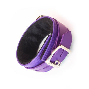 A single Purple Fleece Lined Garment Leather Ankle Cuff is displayed against the background. It is rotated so that the cuff’s lockable buckle is visible.