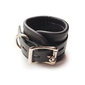 One of the Red Laced Leather Wrist Cuffs is shown against a blank background, displaying the adjustable strap, lockable metal buckle, and D-ring.