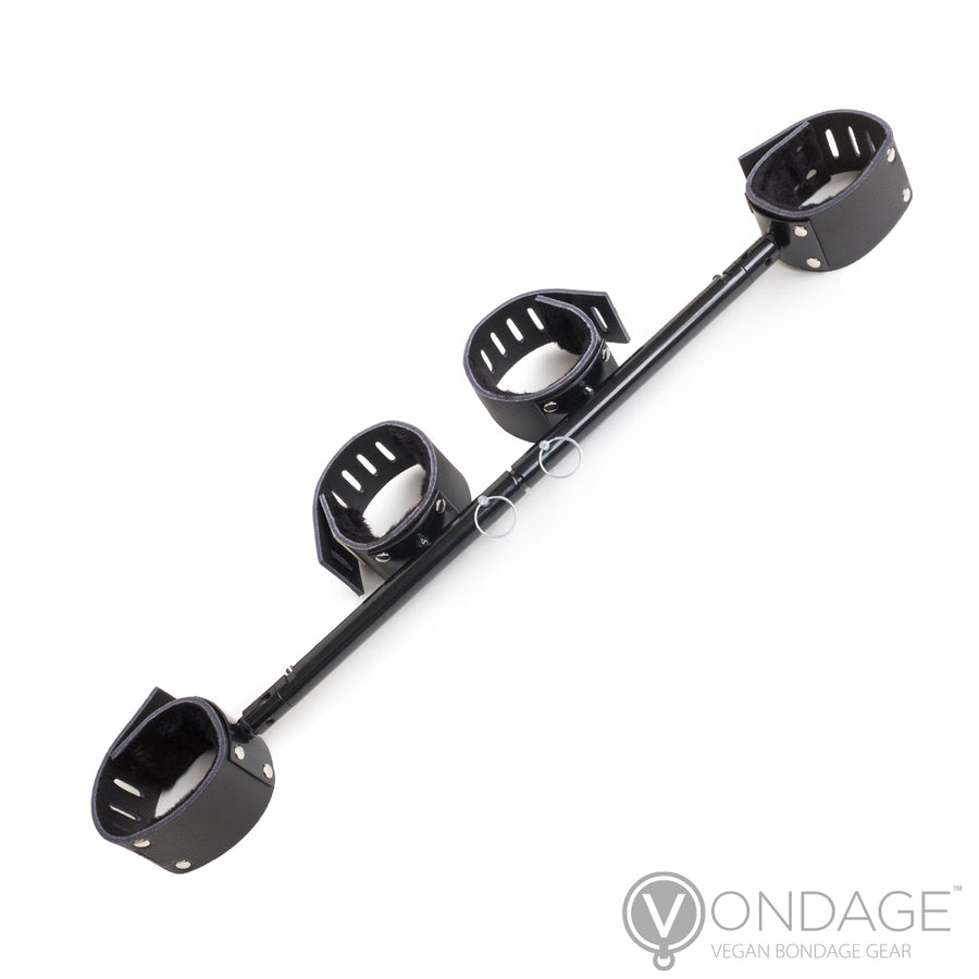 The Vondage Adjustable Stocks with Wrist and Ankle Cuffs are shown against a blank background. The stocks are made of a black spreader bar with pins in the center. There are four black cuffs attached to the bar, two on the end and two in the middle.