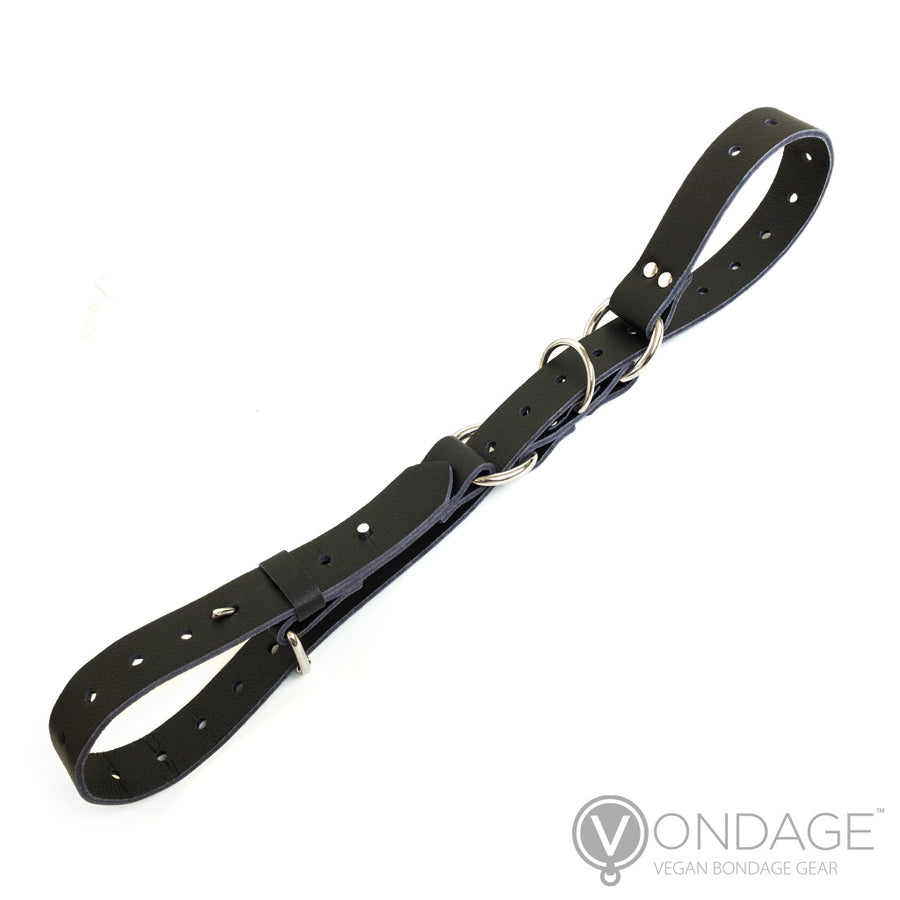 The Vondage Hobble Belt Bondage Device is shown against a blank background. The strap is woven through the D-rings on the belt in order to form two loops.