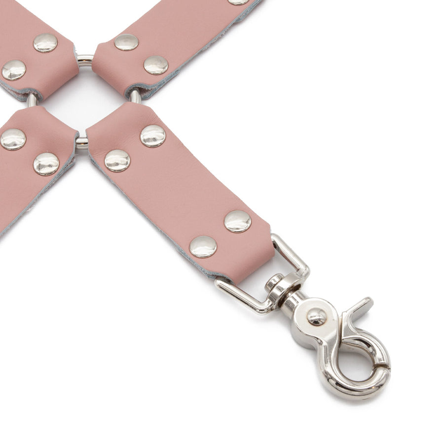 A close-up of one piece of the Stupid Cute Hogtie is shown against a blank background.