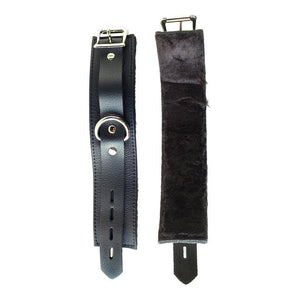 The black Fleece Lined Garment Leather Wrist Cuffs are shown uncuffed against a blank background, with one laying leather side up and the other laying fleece side up.