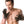 Load image into Gallery viewer, A shirtless man with brown hair wearing Vampire Gloves is shown against a blank background. One of his hands rests on his chest. The other hand is raised with his palm turned towards the camera, showing the spikes on the glove.
