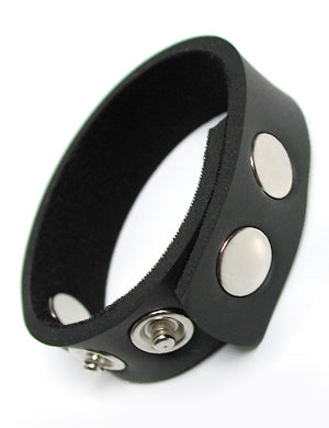 The black KinkLab 5-Snap Neoprene Cock Ring, made of a thin strip of neoprene with five snap closures on it, is displayed against a blank background.