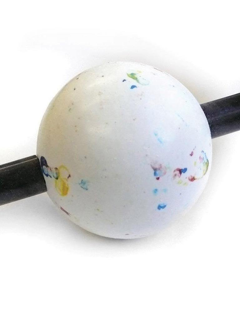A close-up of the jawbreaker on the Black Kinklab Jawbreaker Gag is shown against a blank background. The jawbreaker is white with colored flecks on it.