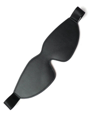 The black, faux-leather Kinklab Padded Blindfold is displayed against a blank background. It has a black elastic strap with a satin finish.