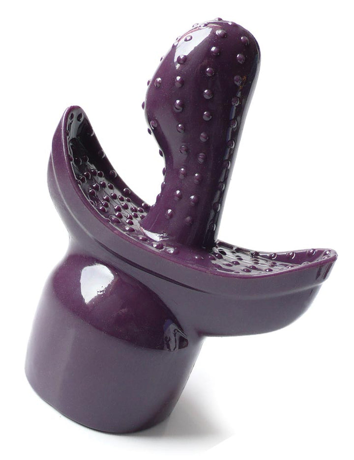 The VibeRite Double Agent wand attachment is displayed against a blank background. It is purple, and the base is shaped like the head of a wand vibrator. There is a textured, curved protrusion in the center. 