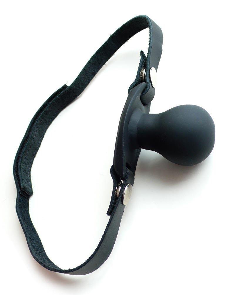 The Tantus Beginner Ball Gag, a gag with a black leather velcro strap and a matte black silicone ball gag, is displayed against a blank background.