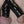 Load image into Gallery viewer, A close-up of a penis is shown with the shaft and top of the scrotum wrapped tightly in black Latex Bondage Strips.
