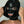 Load image into Gallery viewer, A close-up of a woman&#39;s face is shown wearing the black Extreme Rubber Hood. The hood is unzipped, and she pulls apart the outer layers to reveal the bank robber-style mask underneath. 

