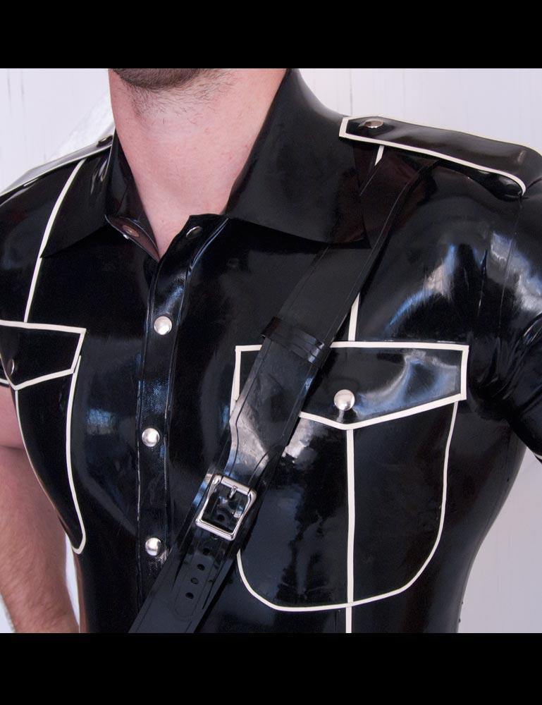A close-up of a man's chest in the Uniform Shirt with Piping by Syren Latex shows the detailing on the shirt.