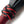 Load image into Gallery viewer, A close-up of the top of the red/black 30-inch Elk Hide Flogger handle is displayed against a blank background.

