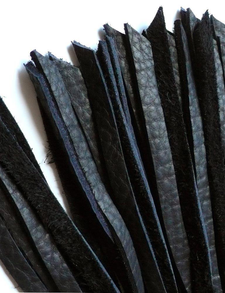 A close-up of the tips of the falls of the 30-inch Elk Hide Floggers in every color is displayed against a blank background.