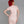 Load image into Gallery viewer, A woman with bright red hair poses in front of a grey backdrop, facing away from the camera. She wears the Latex Scoop Dress from Syren Latex in baby pink. The dress has a zipper down the back.
