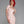 Load image into Gallery viewer, A woman with bright red hair poses in front of a grey backdrop. She wears the Latex Scoop Dress from Syren Latex in baby pink. The dress is form-fitting and has a scoop neck and cap sleeves. The hem cuts off at her mid-thigh.
