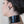 Load image into Gallery viewer, A close-up of the back of a woman&#39;s neck in the Latex Halter Top with a Zipper is shown. The halter neck band is wide, resembling a mock neck style top.
