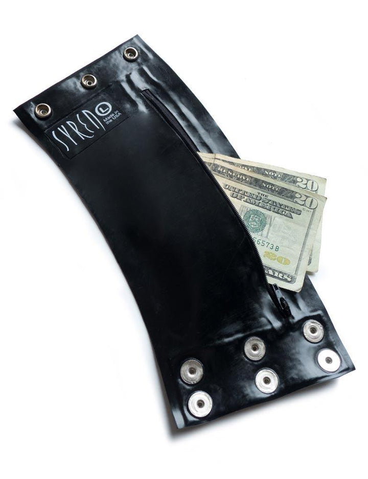 A black Latex Wrist Wallet by Syren Latex is displayed against a blank background. There are two $20 bills in the wallet.