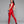 Load image into Gallery viewer, A woman with black hair and red lipstick poses in front of a grey backdrop, wearing the Natural Waist Leggings by Syren Latex in red. She also wears a matching top with blue trim, a matching latex hat, and blue latex glovelettes.
