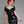 Load image into Gallery viewer, A woman with bright red hair poses in front of a grey backdrop wearing the Latex Sweetheart Dress with Short Sleeves by Syren Latex in black. The dress has a sweetheart neckline and cap sleeves, and the hem cuts off at her mid-thigh.
